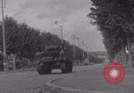 Image of M4 Sherman tank fires in street WW2 Antony France, 1944, second 35 stock footage video 65675079398