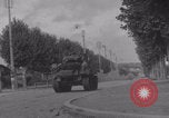 Image of M4 Sherman tank fires in street WW2 Antony France, 1944, second 36 stock footage video 65675079398