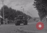 Image of M4 Sherman tank fires in street WW2 Antony France, 1944, second 37 stock footage video 65675079398