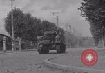 Image of M4 Sherman tank fires in street WW2 Antony France, 1944, second 40 stock footage video 65675079398