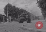 Image of M4 Sherman tank fires in street WW2 Antony France, 1944, second 42 stock footage video 65675079398