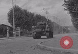 Image of M4 Sherman tank fires in street WW2 Antony France, 1944, second 43 stock footage video 65675079398