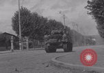 Image of M4 Sherman tank fires in street WW2 Antony France, 1944, second 44 stock footage video 65675079398