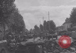 Image of M4 Sherman tank fires in street WW2 Antony France, 1944, second 45 stock footage video 65675079398