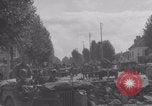 Image of M4 Sherman tank fires in street WW2 Antony France, 1944, second 48 stock footage video 65675079398