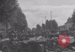 Image of M4 Sherman tank fires in street WW2 Antony France, 1944, second 50 stock footage video 65675079398