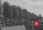 Image of M4 Sherman tank fires in street WW2 Antony France, 1944, second 55 stock footage video 65675079398