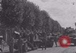 Image of M4 Sherman tank fires in street WW2 Antony France, 1944, second 56 stock footage video 65675079398