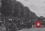 Image of M4 Sherman tank fires in street WW2 Antony France, 1944, second 57 stock footage video 65675079398