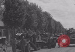 Image of M4 Sherman tank fires in street WW2 Antony France, 1944, second 60 stock footage video 65675079398