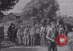 Image of M4 Sherman tank fires in street WW2 Antony France, 1944, second 61 stock footage video 65675079398