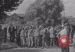 Image of M4 Sherman tank fires in street WW2 Antony France, 1944, second 62 stock footage video 65675079398