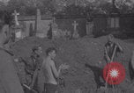 Image of German prisoners digging graves Normandy Dompaire France, 1944, second 38 stock footage video 65675079421