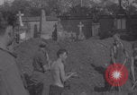 Image of German prisoners digging graves Normandy Dompaire France, 1944, second 39 stock footage video 65675079421