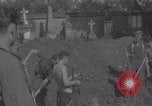 Image of German prisoners digging graves Normandy Dompaire France, 1944, second 42 stock footage video 65675079421