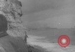 Image of soldiers on Omaha Beach WW2 Normandy France, 1944, second 6 stock footage video 65675079431