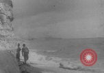 Image of soldiers on Omaha Beach WW2 Normandy France, 1944, second 8 stock footage video 65675079431