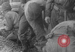 Image of soldiers on Omaha Beach WW2 Normandy France, 1944, second 20 stock footage video 65675079431