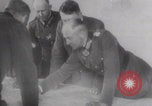 Image of Hitler plans while soldiers fight WW2 Normandy France, 1944, second 1 stock footage video 65675079447