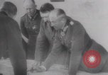 Image of Hitler plans while soldiers fight WW2 Normandy France, 1944, second 5 stock footage video 65675079447