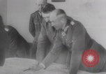 Image of Hitler plans while soldiers fight WW2 Normandy France, 1944, second 6 stock footage video 65675079447