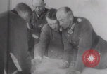 Image of Hitler plans while soldiers fight WW2 Normandy France, 1944, second 10 stock footage video 65675079447