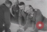Image of Hitler plans while soldiers fight WW2 Normandy France, 1944, second 15 stock footage video 65675079447