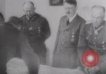 Image of Hitler plans while soldiers fight WW2 Normandy France, 1944, second 17 stock footage video 65675079447