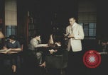 Immagine di Casa Italiana library students reading United States USA, 1957, secondo 20 filmato di repertorio 65675079455