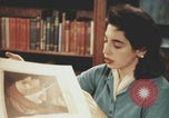 Immagine di Casa Italiana library students reading United States USA, 1957, secondo 35 filmato di repertorio 65675079455