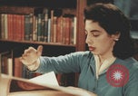 Immagine di Casa Italiana library students reading United States USA, 1957, secondo 36 filmato di repertorio 65675079455