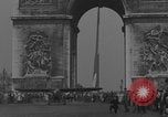 Image of Piper Cub flying Avenue des Champs Elysees Paris France, 1944, second 3 stock footage video 65675079487
