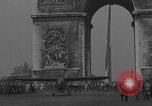 Image of Piper Cub flying Avenue des Champs Elysees Paris France, 1944, second 4 stock footage video 65675079487