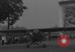 Image of Piper Cub flying Avenue des Champs Elysees Paris France, 1944, second 6 stock footage video 65675079487