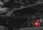 Image of Piper Cub flying Avenue des Champs Elysees Paris France, 1944, second 7 stock footage video 65675079487