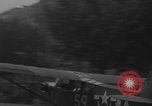 Image of Piper Cub flying Avenue des Champs Elysees Paris France, 1944, second 8 stock footage video 65675079487