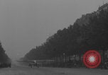 Image of Piper Cub flying Avenue des Champs Elysees Paris France, 1944, second 11 stock footage video 65675079487