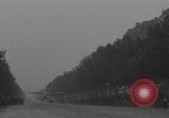 Image of Piper Cub flying Avenue des Champs Elysees Paris France, 1944, second 13 stock footage video 65675079487