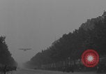 Image of Piper Cub flying Avenue des Champs Elysees Paris France, 1944, second 17 stock footage video 65675079487