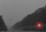 Image of Piper Cub flying Avenue des Champs Elysees Paris France, 1944, second 18 stock footage video 65675079487