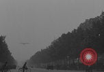 Image of Piper Cub flying Avenue des Champs Elysees Paris France, 1944, second 19 stock footage video 65675079487