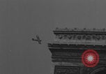Image of Piper Cub flying Avenue des Champs Elysees Paris France, 1944, second 23 stock footage video 65675079487