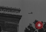 Image of Piper Cub flying Avenue des Champs Elysees Paris France, 1944, second 27 stock footage video 65675079487