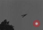 Image of Piper Cub flying Avenue des Champs Elysees Paris France, 1944, second 31 stock footage video 65675079487