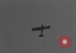 Image of Piper Cub flying Avenue des Champs Elysees Paris France, 1944, second 33 stock footage video 65675079487
