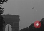 Image of Piper Cub flying Avenue des Champs Elysees Paris France, 1944, second 35 stock footage video 65675079487