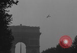 Image of Piper Cub flying Avenue des Champs Elysees Paris France, 1944, second 36 stock footage video 65675079487