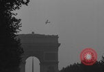 Image of Piper Cub flying Avenue des Champs Elysees Paris France, 1944, second 37 stock footage video 65675079487