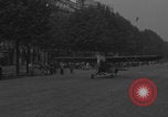 Image of Piper Cub flying Avenue des Champs Elysees Paris France, 1944, second 44 stock footage video 65675079487