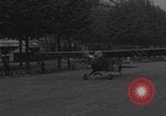 Image of Piper Cub flying Avenue des Champs Elysees Paris France, 1944, second 45 stock footage video 65675079487